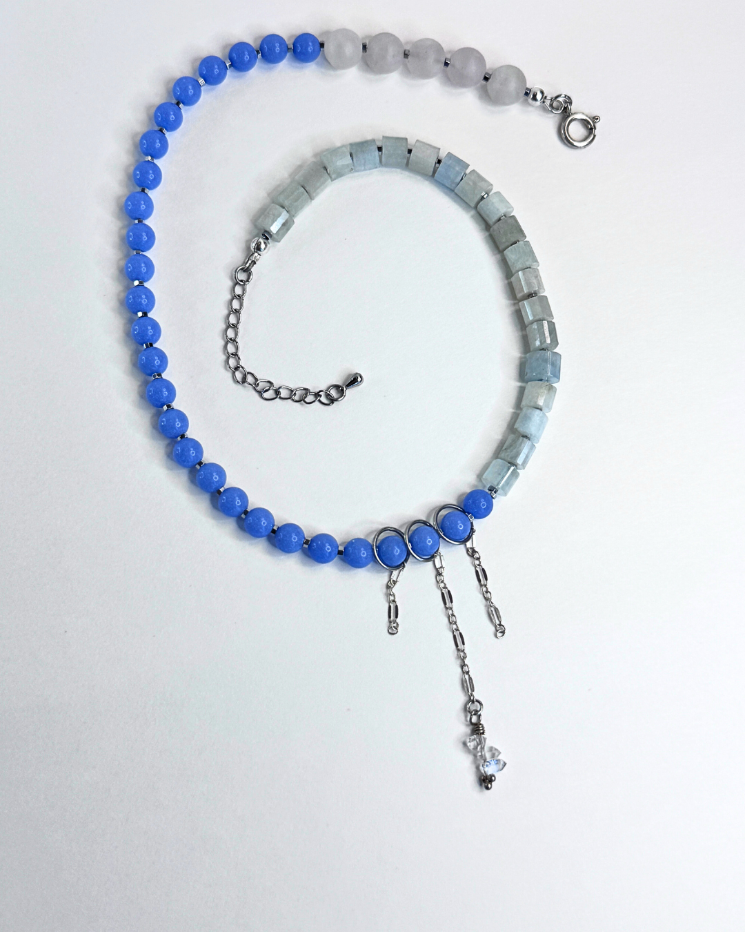 Necklace with blue and gray beads on a white background