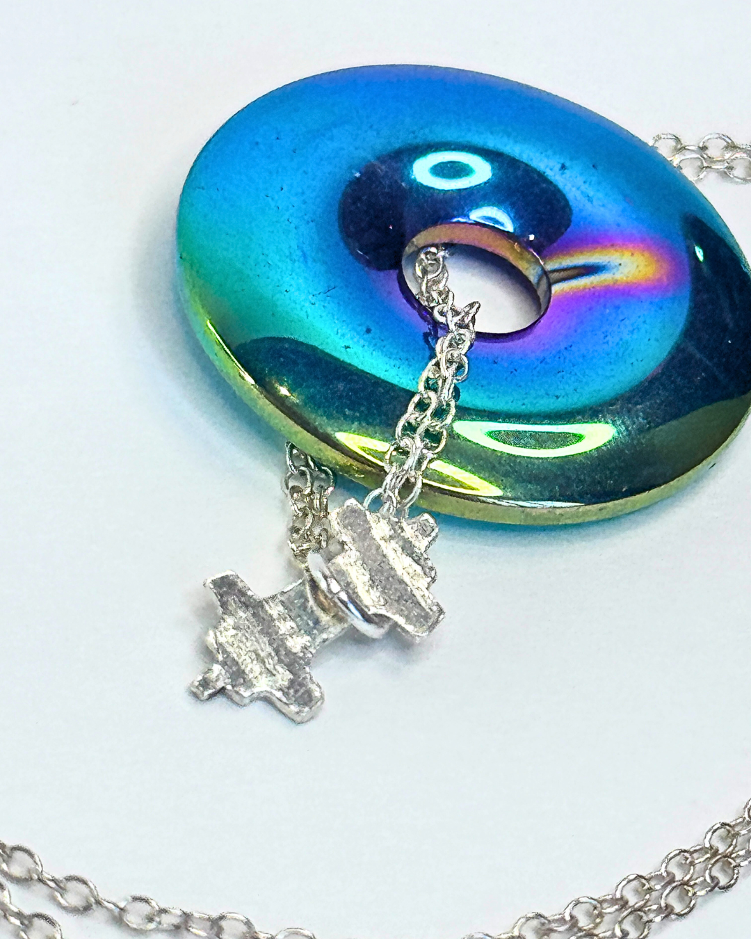Necklace with a colorful pendant on a white background