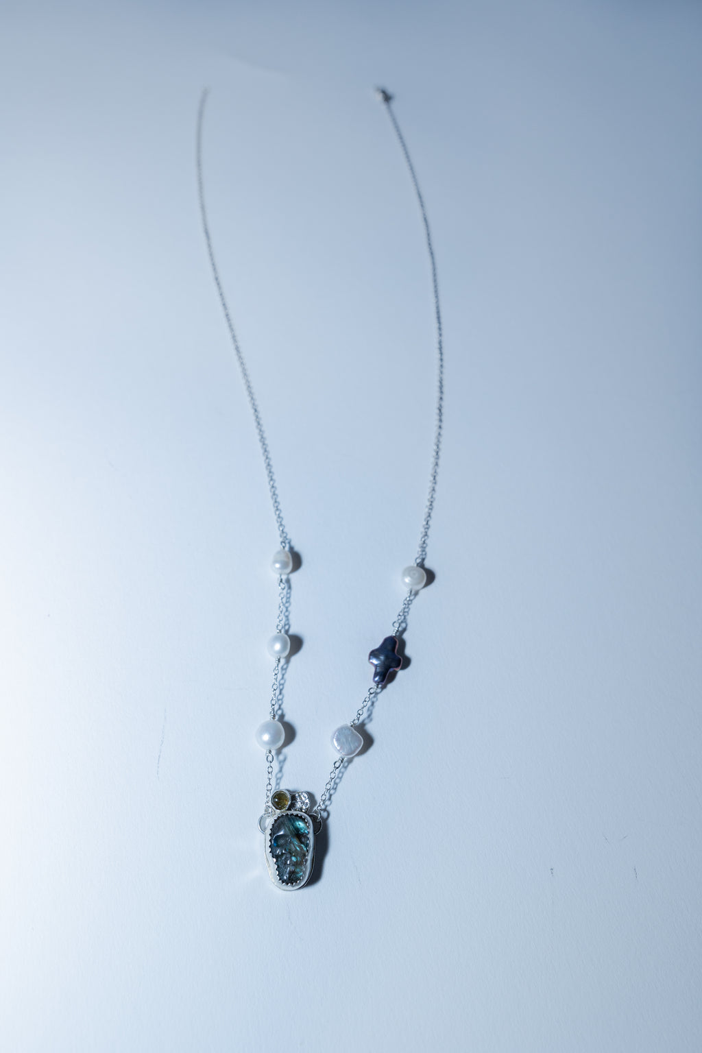 Necklace with a pendant on a white background