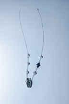 Necklace with a pendant on a white background