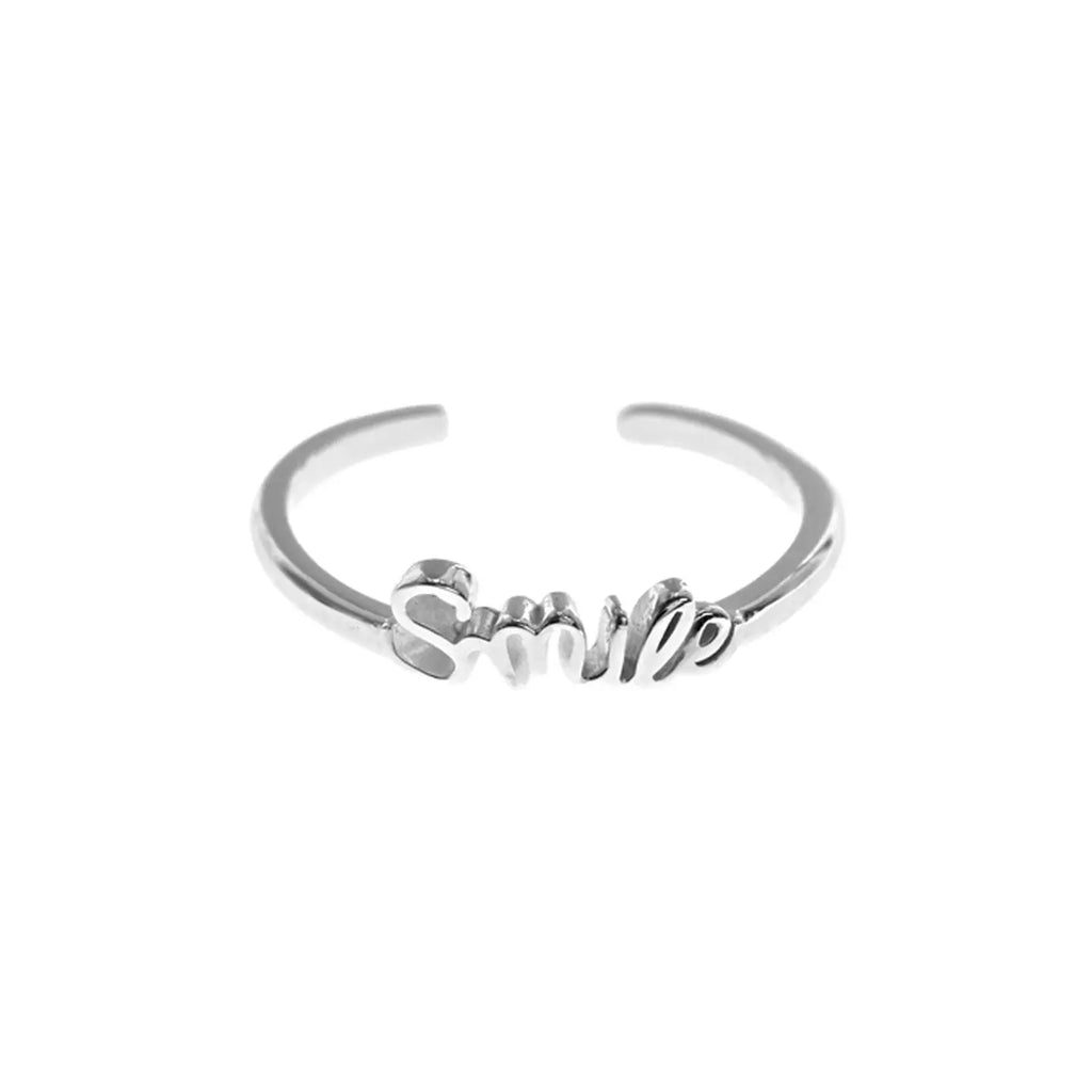 Silver bracelet with 'SMILE' text on a white background