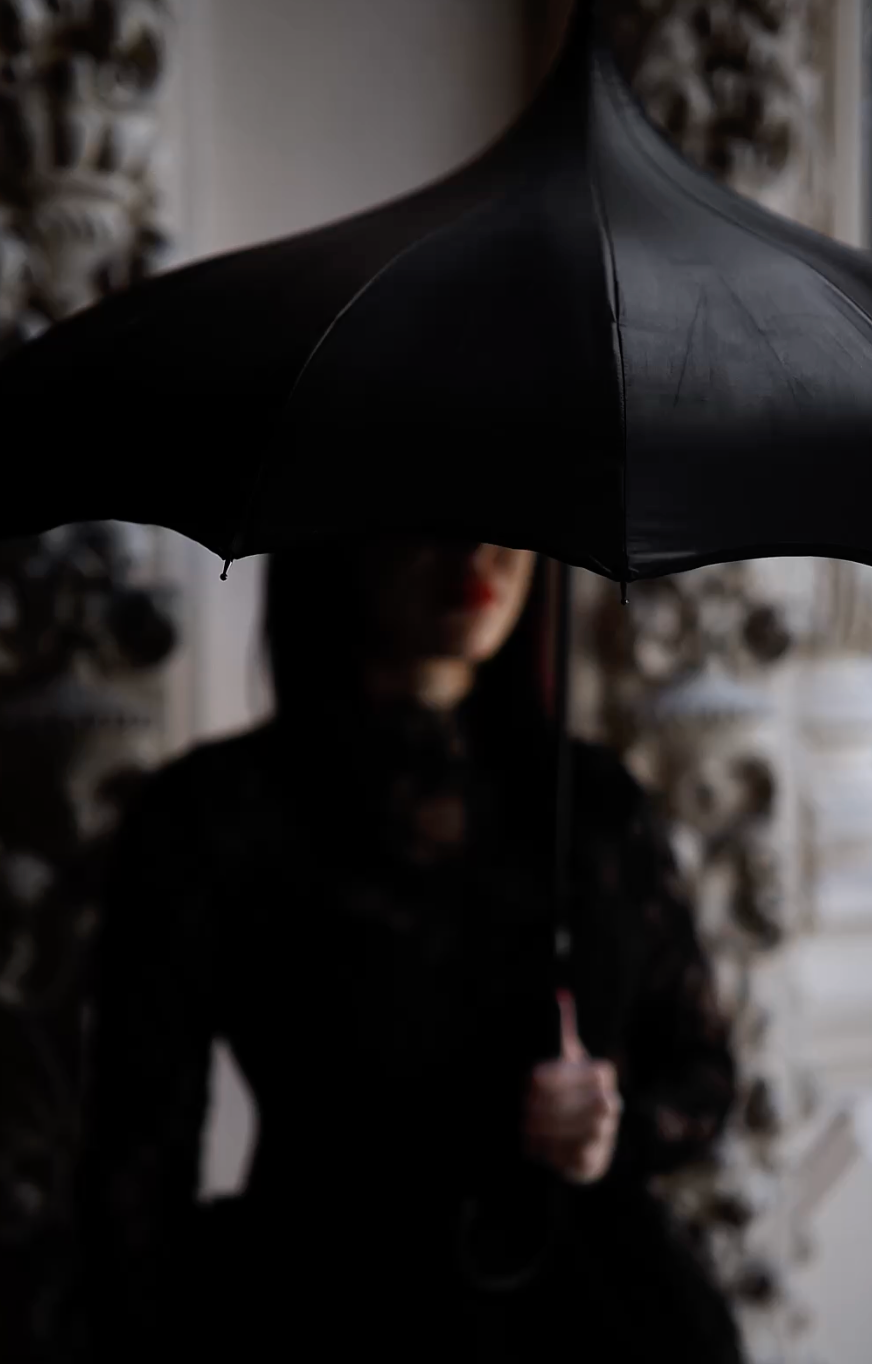 girl standing in goth outfit showcasing the wild within halloween collection