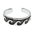 Silver toe ring with wave pattern on a white background
